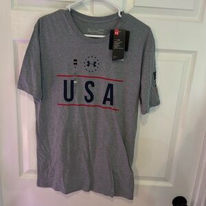 #30 Men’s Under Armour new with tags USA Freedom flag shirt.
